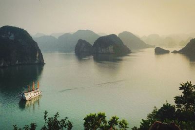 Calm lake with mountains in background