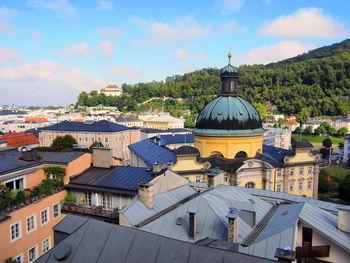 Buildings in city against sky