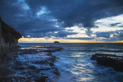 Scenic view of sea against sky during sunset