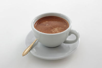 Close-up of coffee on white background