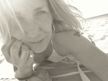 Close-up portrait of woman on beach