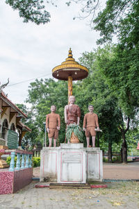 View of buddha statue against trees