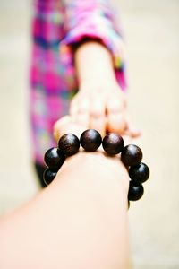 Cropped woman holding boyfriend hand