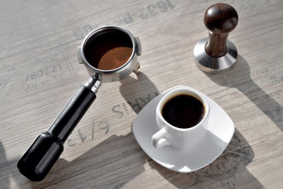 High angle view of coffee cup on table