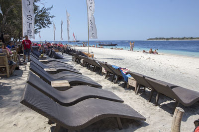 People on beach against sky