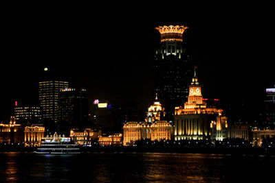 Illuminated buildings in city at night