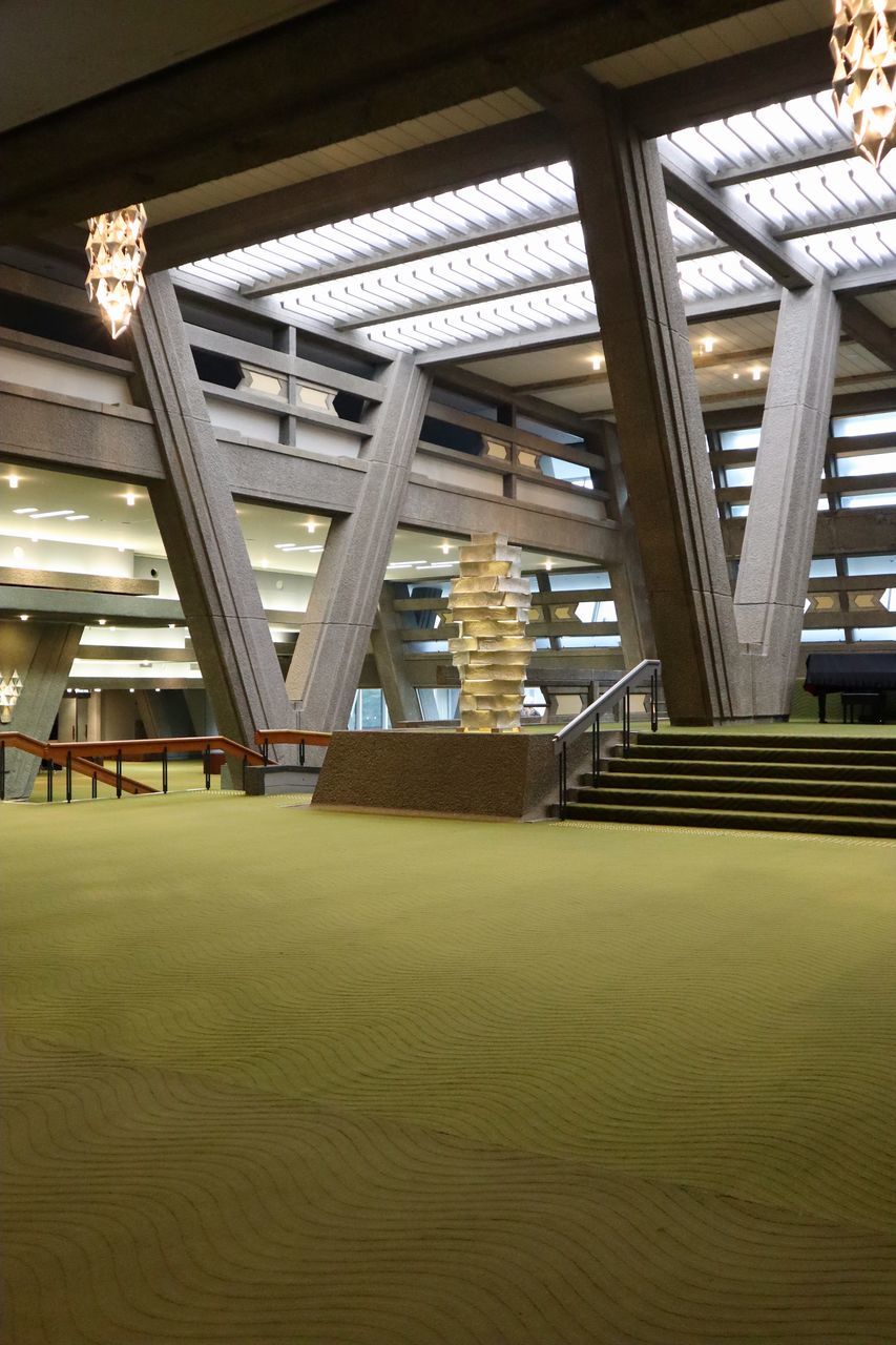 LOW ANGLE VIEW OF ILLUMINATED BUILDING INTERIOR