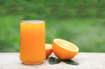 Close-up of orange juice on table