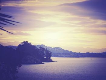 Scenic view of lake against cloudy sky