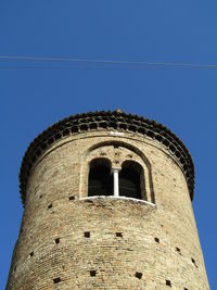 Low angle view of historic building against clear blue sky