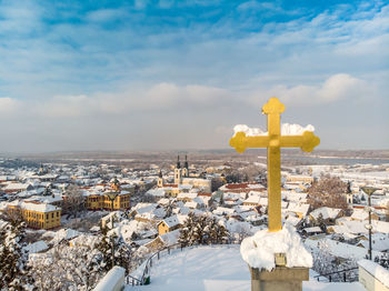 Panoramic view of townscape against sky during winter