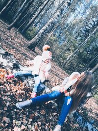 High angle view of people relaxing in forest