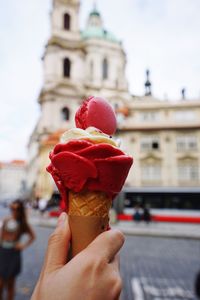 Close-up of hand holding ice cream cone