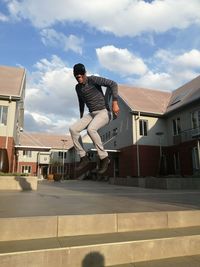 Man building against sky in city