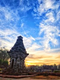 Ancient temple against sky during sunset