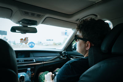 Man sitting in car