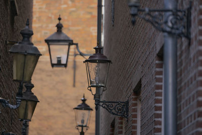 Low angle view of street light against building