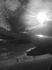 Airplane flying in sky on sunny day