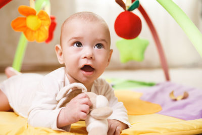 Close-up of cute baby girl with teddy bear