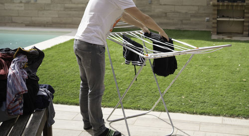 Low section of man standing on street