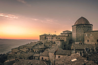 Buildings against sky during sunset
