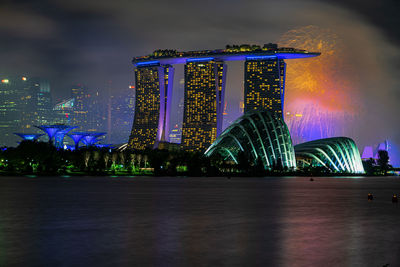 Illuminated modern buildings in city at night