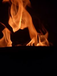 Close-up of bonfire against black background