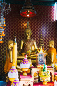 Sculpture of buddha statue in temple outside building