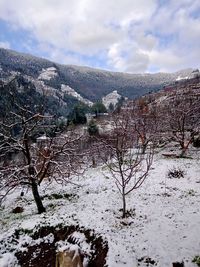 Scenic view of snowcapped mountains against sky