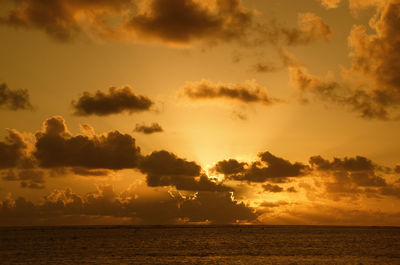 Scenic view of sea against sky at sunset