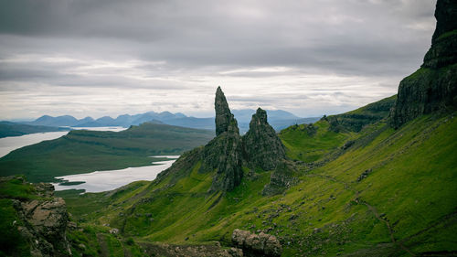 Panoramic view of landscape and mountains against sky - old man of storr