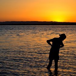Silhouette of people at sunset