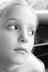 Close-up of thoughtful girl looking away