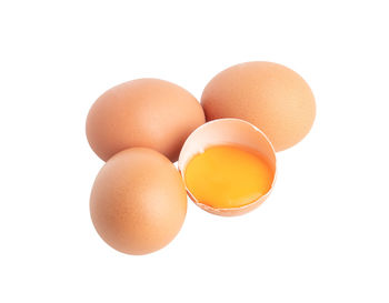 Close-up of eggs against white background