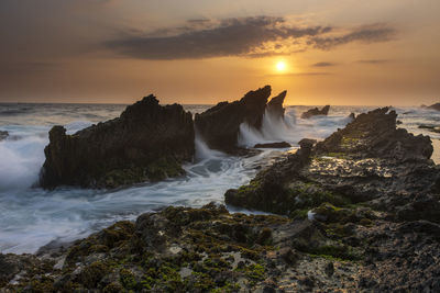 Scenic view of sea against sky during sunset