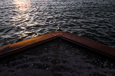 High angle view of boat in sea during sunset