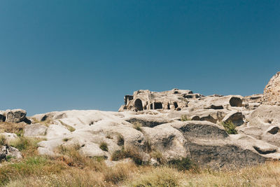 Old ruins against clear blue sky