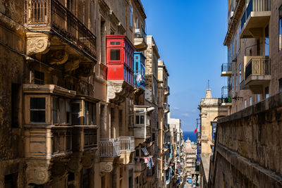 Buildings against blue sky in city