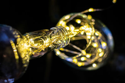 Close-up of illuminated lighting equipment on table
