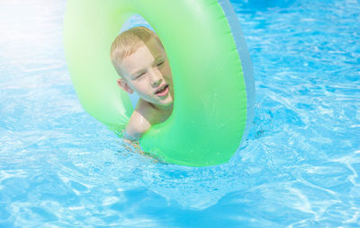 Portrait of boy in swimming pool