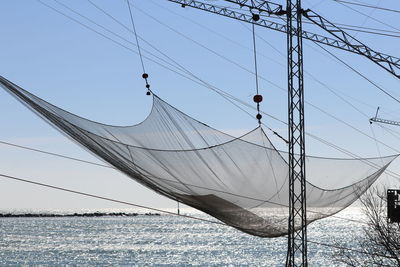 Sailboats on sea against sky