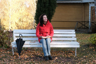 Young woman sitting on bench