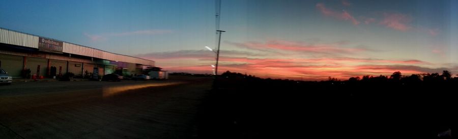 Panoramic view of road against sky at sunset