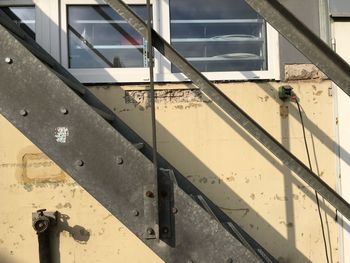 Close-up of man on metal structure