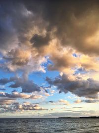 Scenic view of sea against dramatic sky