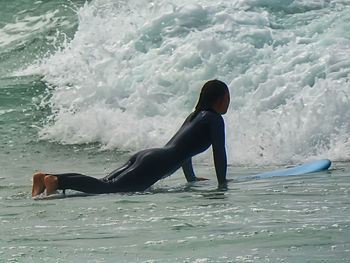 Side view of senior woman on sea shore