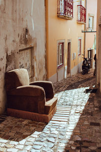 Old-fashioned armchair on the street. retro furniture outdoors.