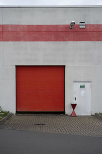 Red closed door of building