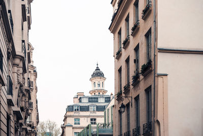 Low angle view of buildings against clear sky