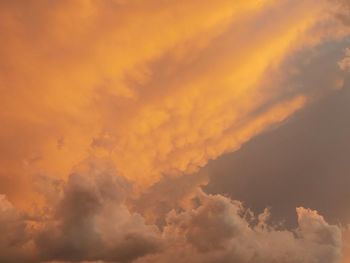 Low angle view of dramatic sky during sunset